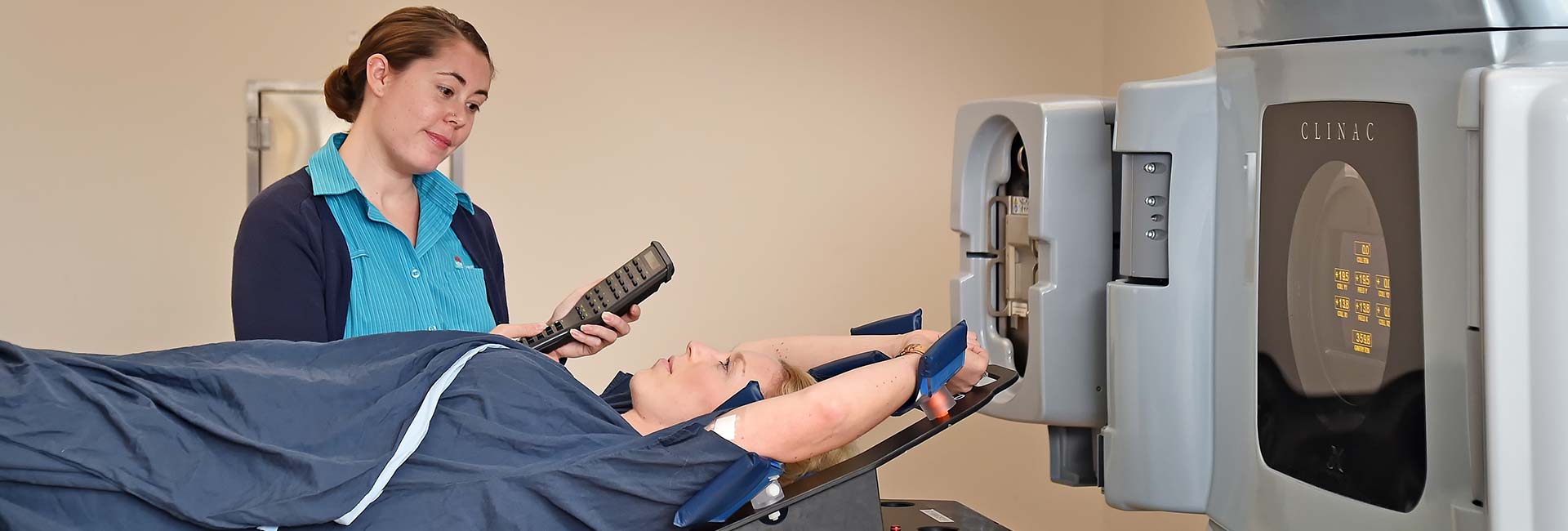 Nurse With Patient On Equipment